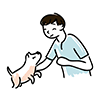 男の子が犬に手を差し伸べているイラスト